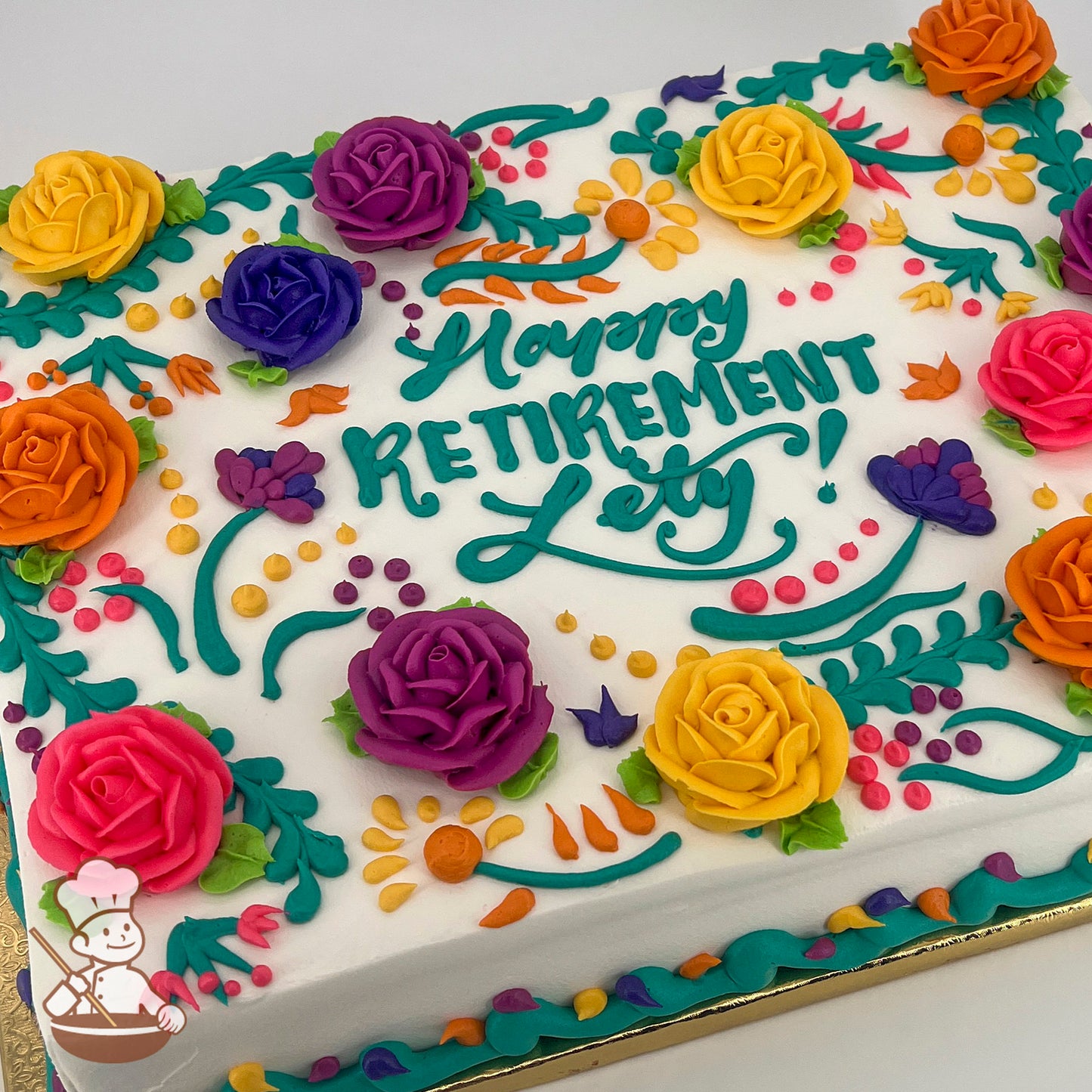 Sheet cake with colorful buttercream roses, including yellow, pink, orange, and purple. Decorated with vines, dots, and leaves in a festive Mexican Fiesta style.