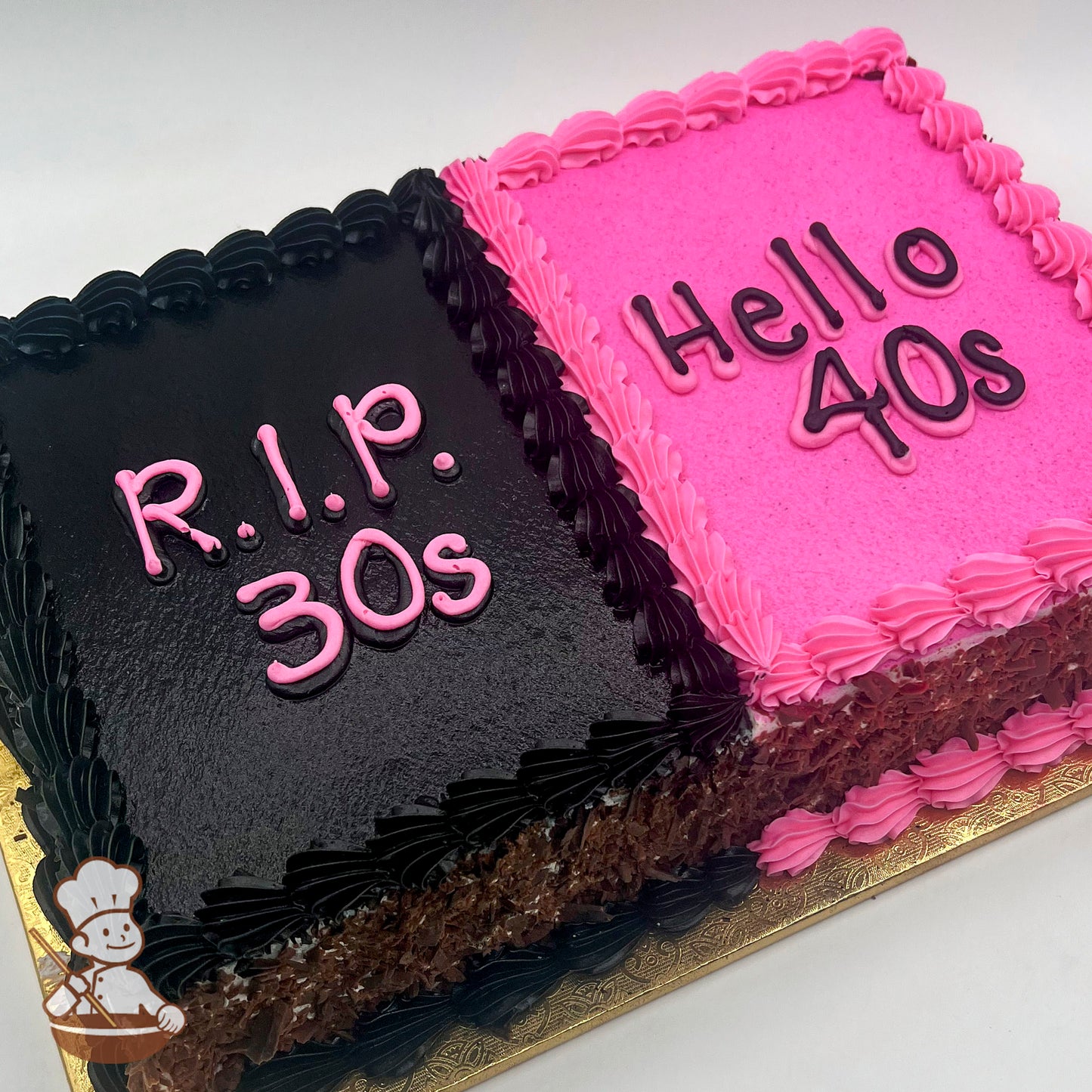 A rectangular sheet cake with two halves: one black with pink buttercream borders and the other pink with pink and black buttercream borders.