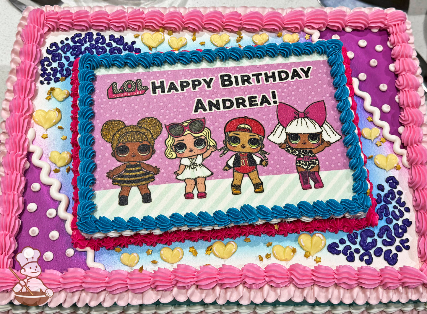 Sheet cake with pink, blue, and white buttercream borders, yellow heart decorations, and purple leopard print accents.