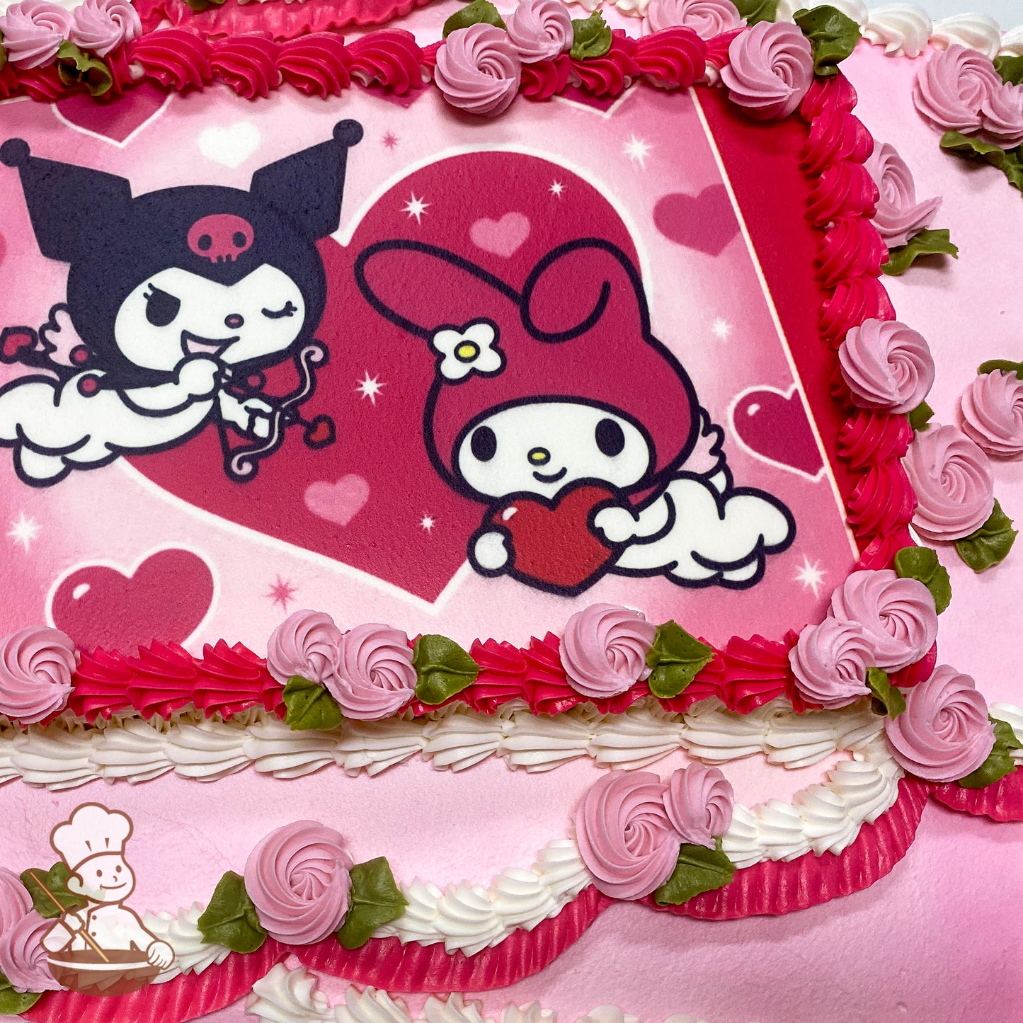 Sheet cake with pink and white buttercream ruffles, pink swirlette buds with green leaves, and a printed photo layer featuring cartoon characters.