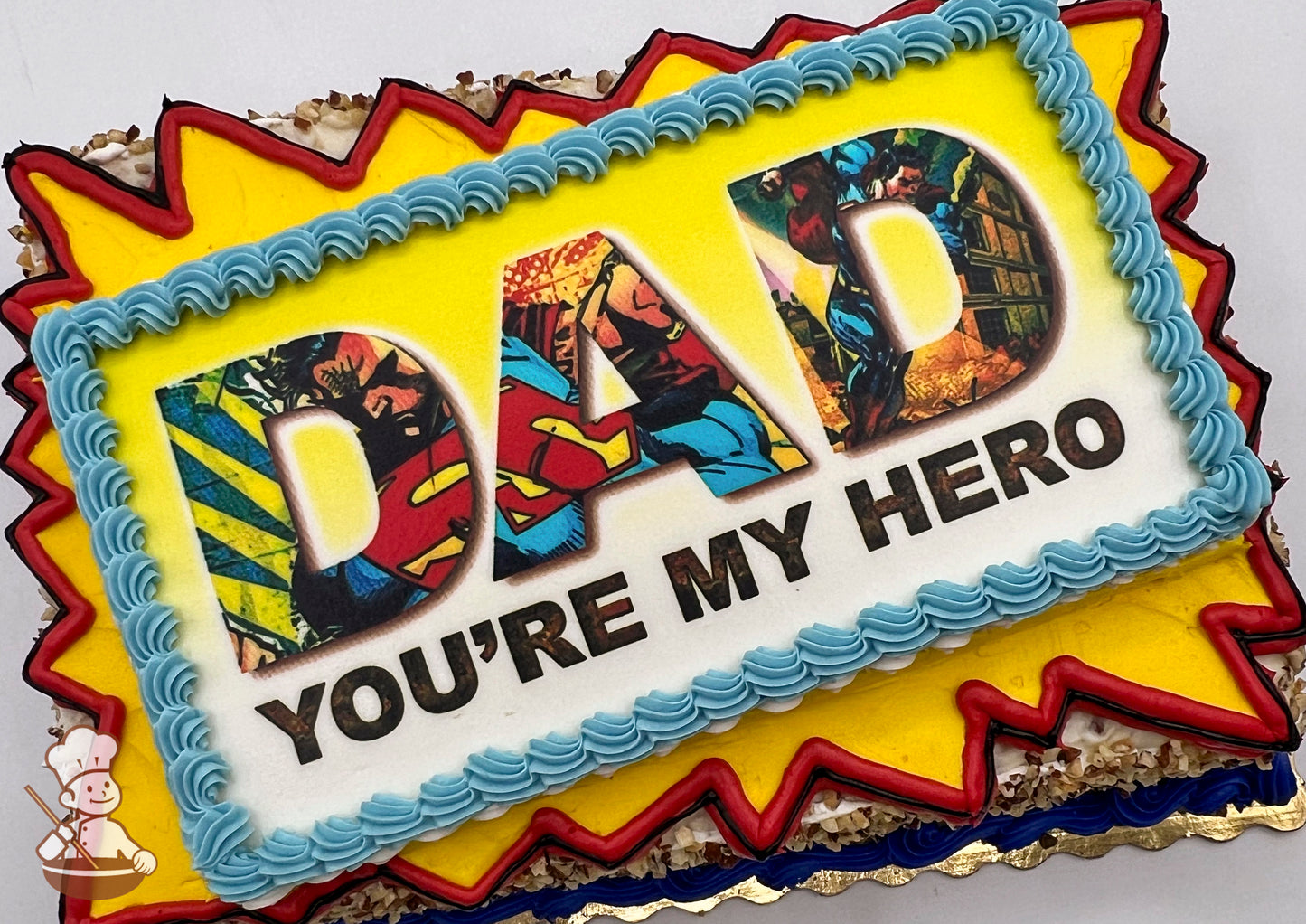 Sheet cake with a yellow starburst frame outlined in red, and blue buttercream border.