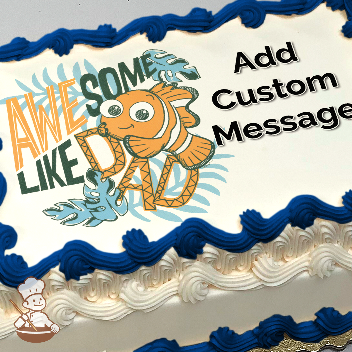 Cartoon clownfish with "AWESOME LIKE DAD" text, surounded by blue leaves, printed on a sheet cake.