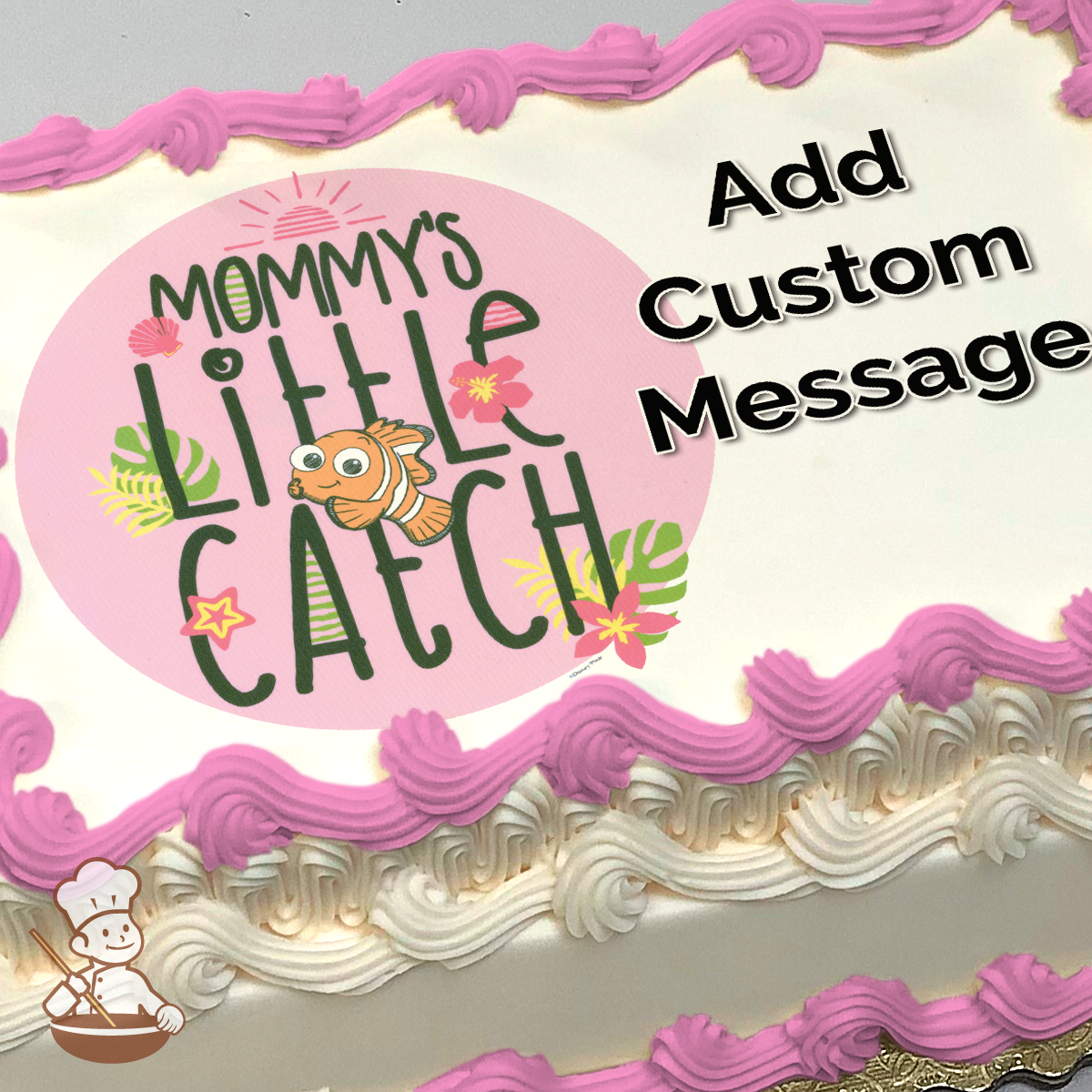 Illustration of a clownfish with "Mommy's Little Catch" text, tropical flowers and leaves on a pink circle, printed on a sheet cake.