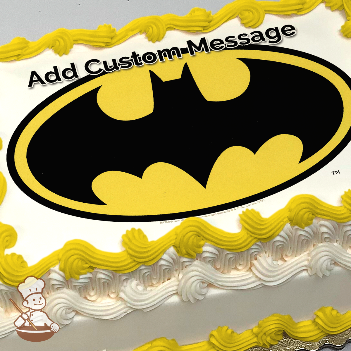 Iconic Batman symbol centered on a sheet cake.