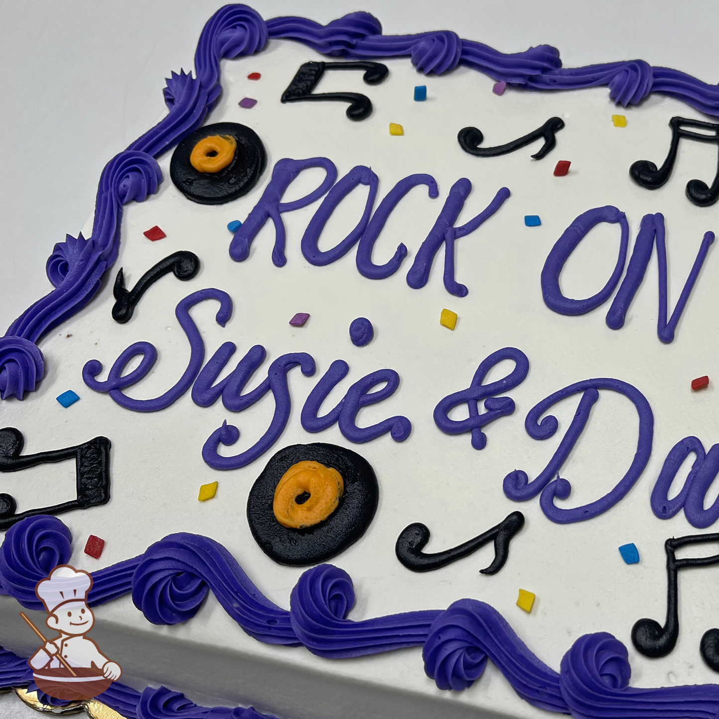 Birthday sheet cake with sprinkles and buttercream music notes and records.