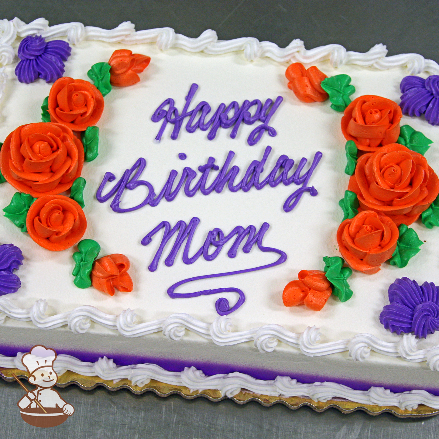 Birthday sheet cake with buttercream roses in an oval pattern.