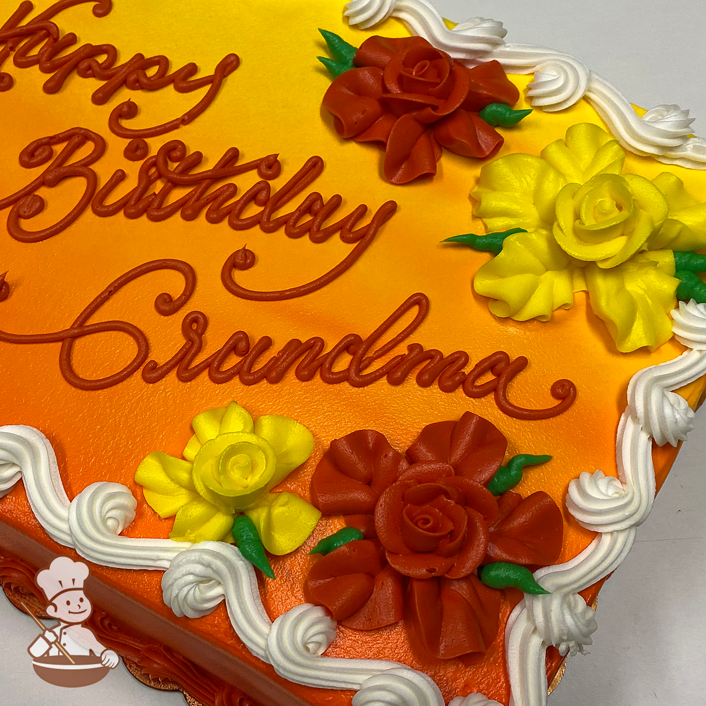Birthday sheet cake with buttercream Hawaiian flowers and ombre background.