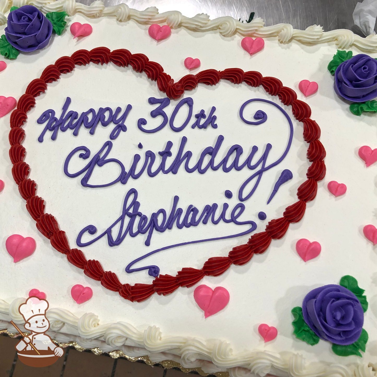 Birthday sheet cake with buttercream heart frame, mini hearts and roses.
