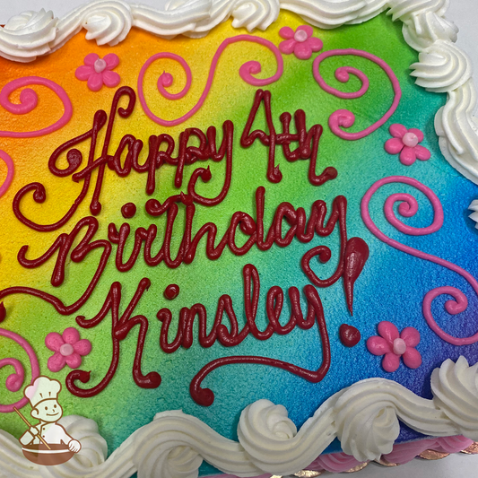 Birthday sheet cake with buttercream scrolls and daisies with rainbow background.