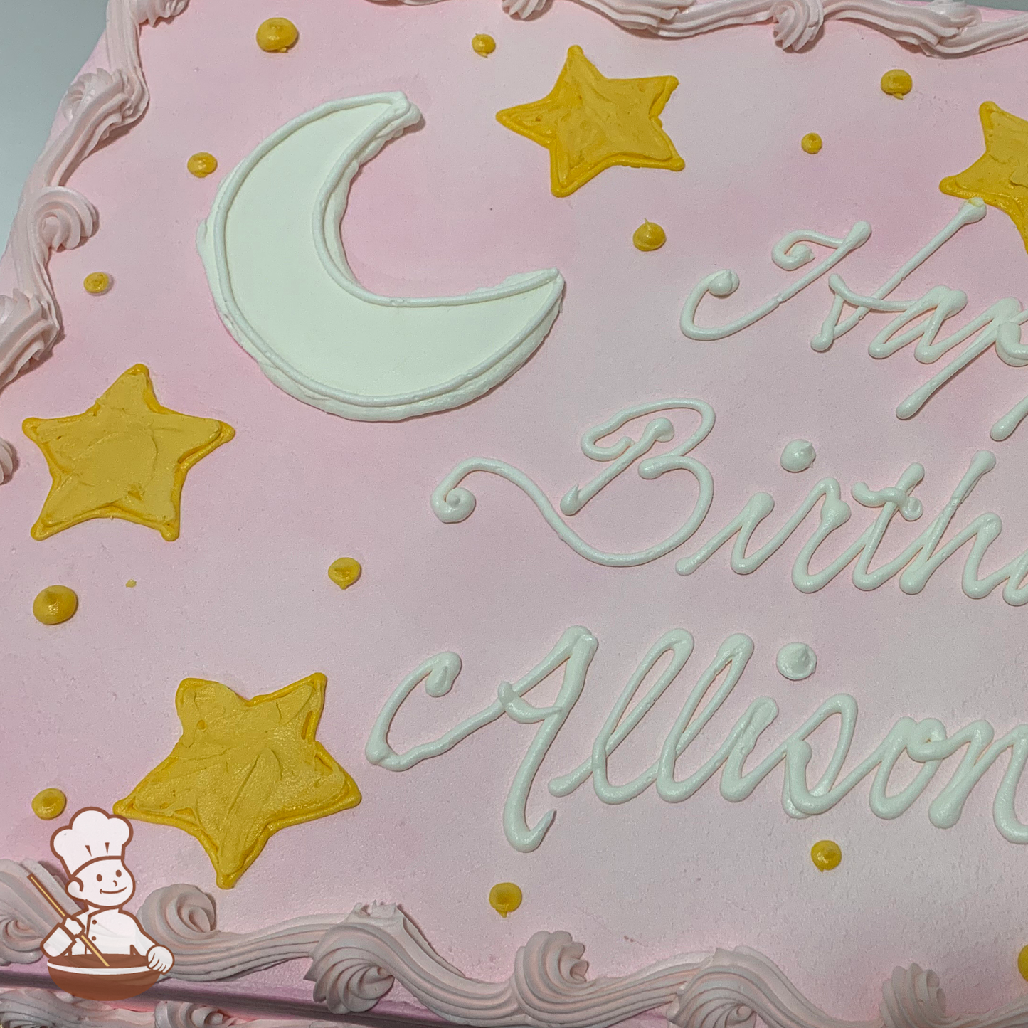 Birthday sheet cake with buttercream stars, crescent moon and dots.