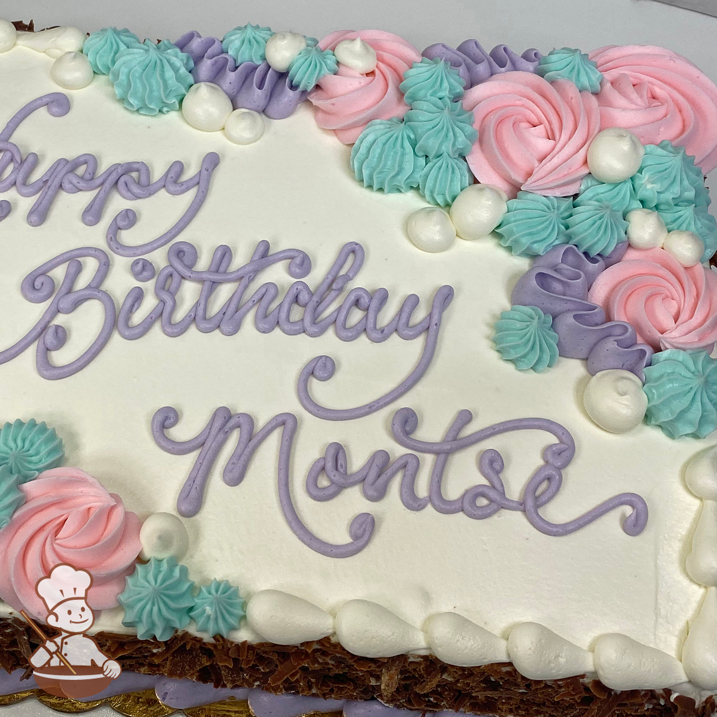 Birthday sheet cake with ocean and mermaid themed swirls, corals and pearls.