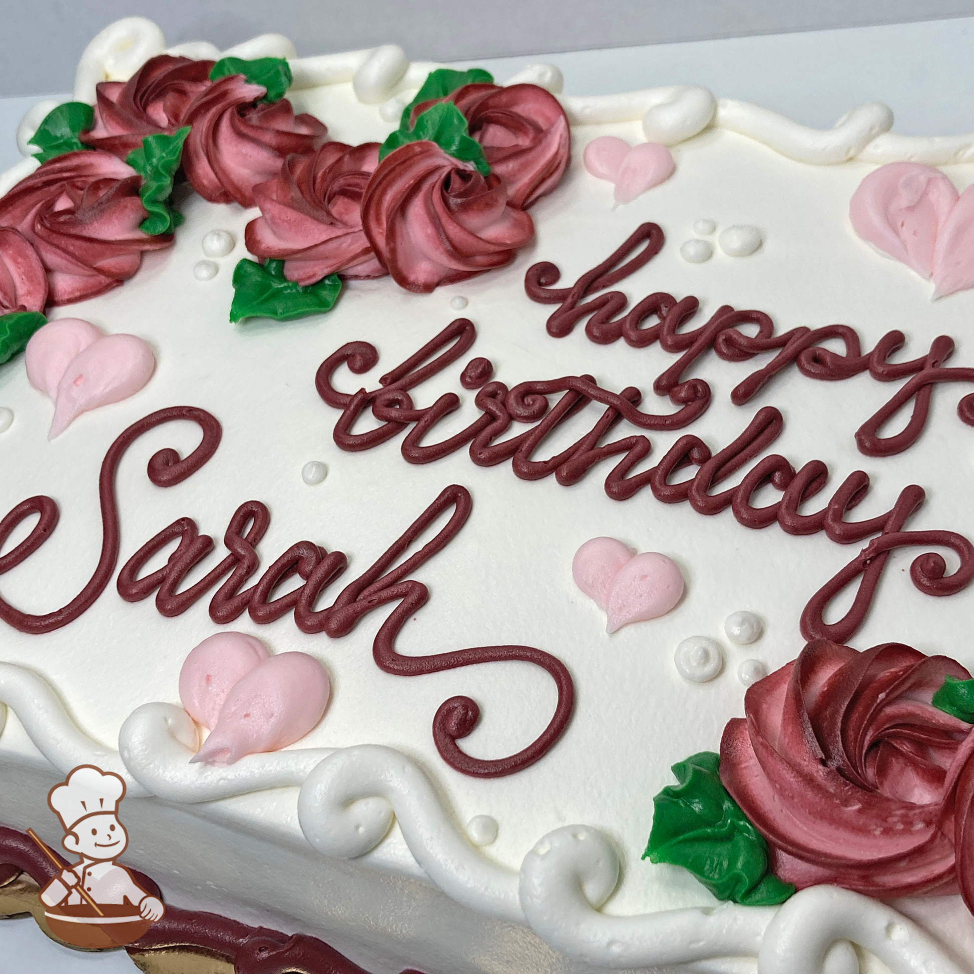 Birthday sheet cake with buttercream swirlette flowers and hearts.
