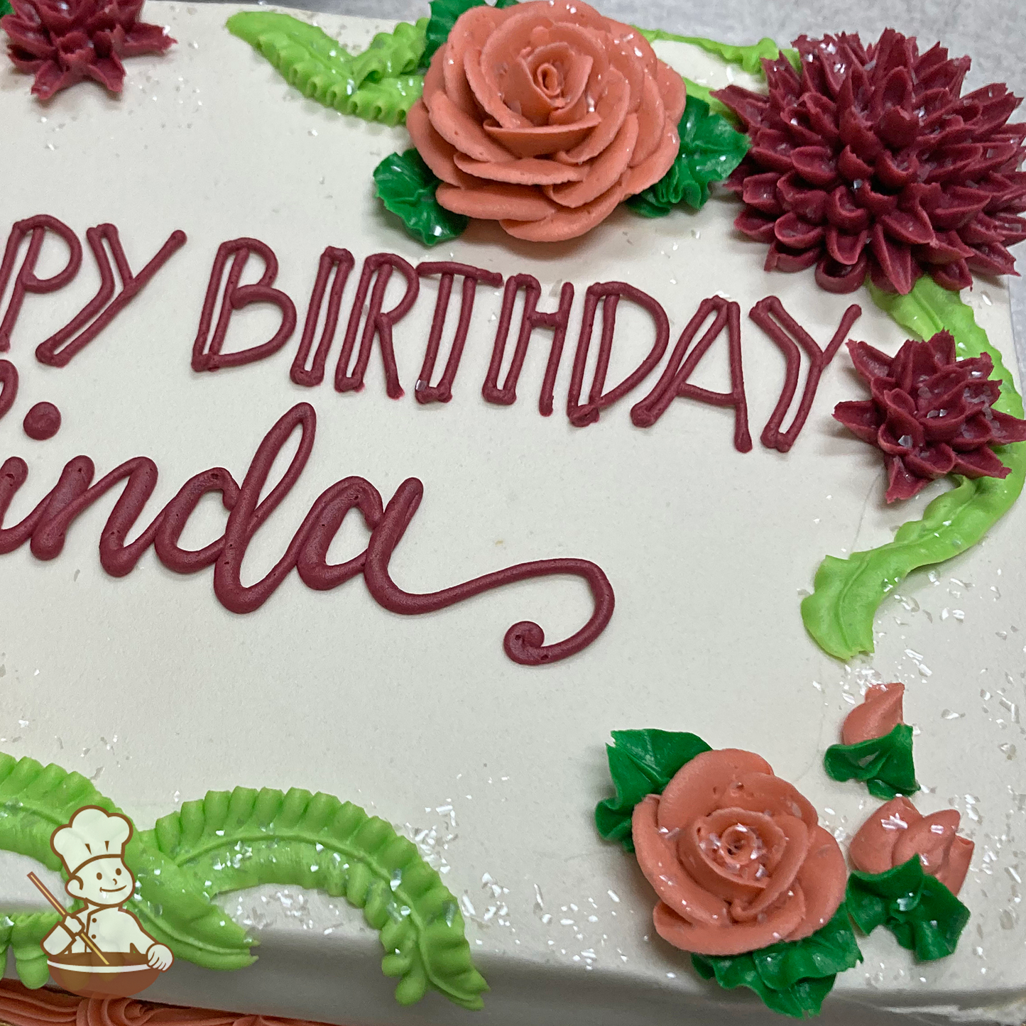 Birthday sheet cake with buttercream roses and dahlia flowers.
