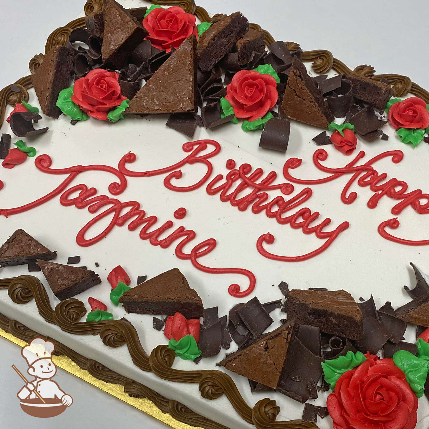 Birthday sheet cake with buttercream roses and chocolate brownies decorating the cake.