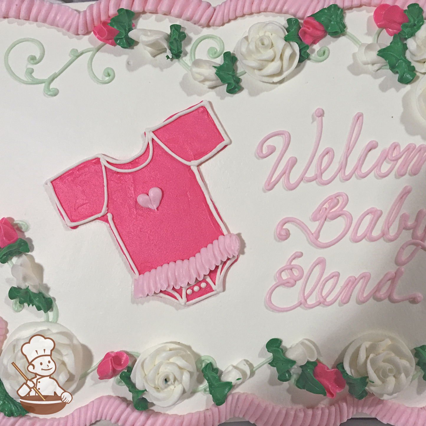 Baby shower sheet cake with buttercream piped baby onesie with tutu skirt.
