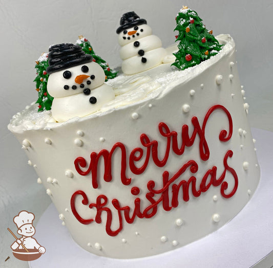 Single tier cake with smooth white icing, decorated with buttercream snowman, trees and a Merry Christmas message in the front of the cake.