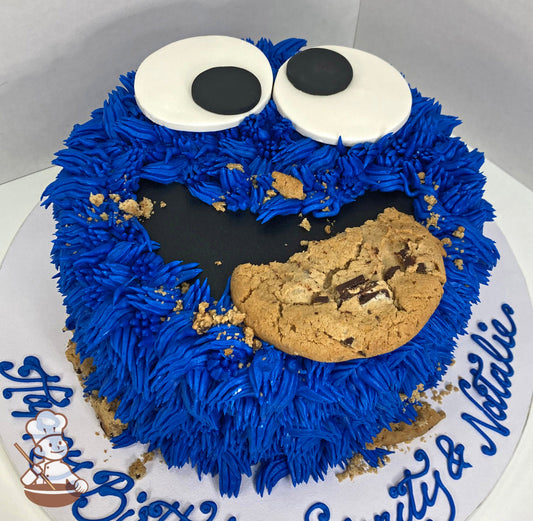 Single tier cake decorated to look like Cookie Monster's face.