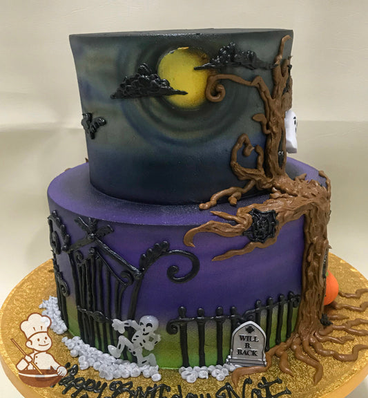 2-tier round cake with Halloween themed buttercream decorations including a tree and fence.