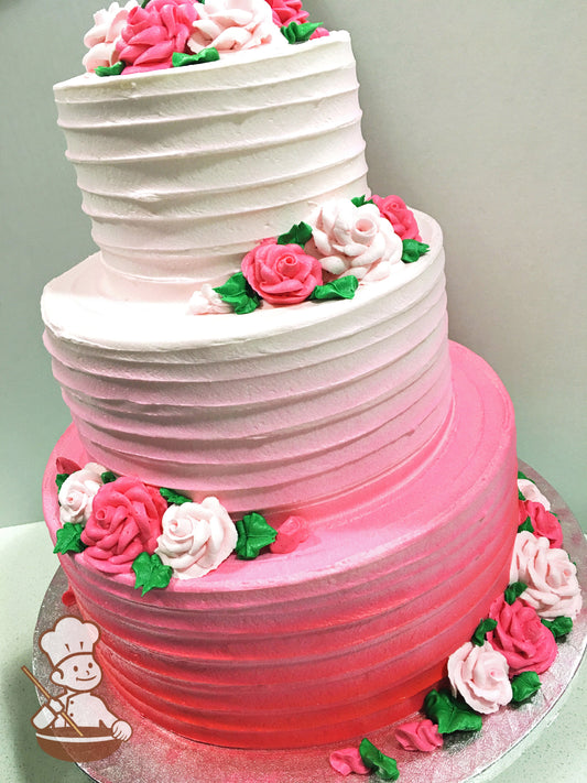 3-tier round cake with horizontal textured icing and hot pink to white Ombre colored-icing, decorated with pink buttercream roses.