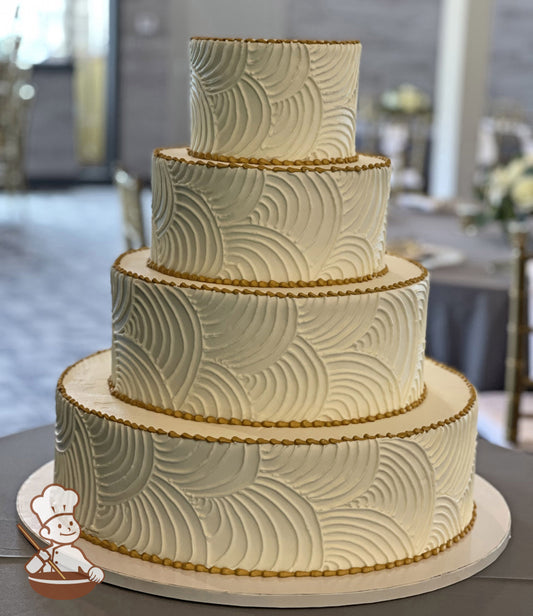 4-tier round cake with smooth white icing and hand-piped white buttercream curved lines all over cake walls and metallic gold trims.