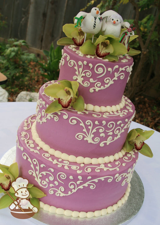 3-tier cake with orchid-color smooth icing and decorated with cream-colored buttercream scrolls and cream-colored buttercream beaded trims.