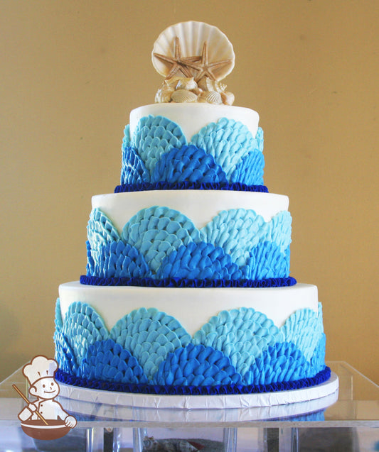 3-tier cake wtih overlapping patterns of blue waves.