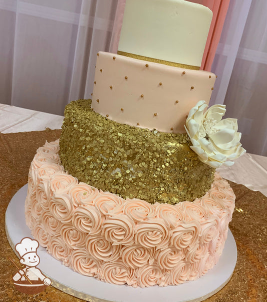 4 tier round cake with peach color rosette swirls on base and textured gold middle tier & finished with gold pearl beads and sugar peony.