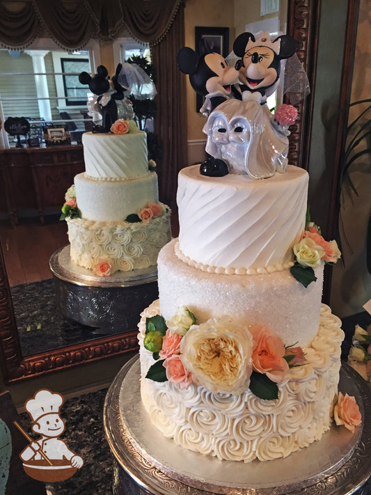 3 tier round wedding cake with rosette swirl base, sugar crystal cover middle and diagonal texture on top and finished with fresh flowers.