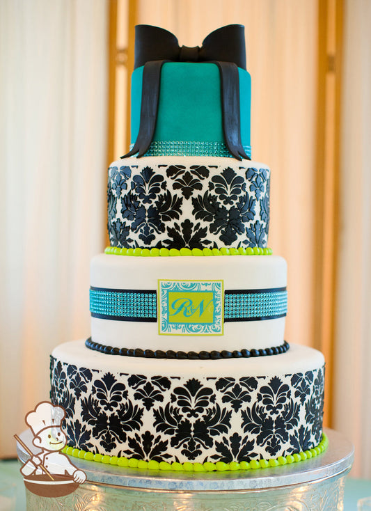 4 tier fondant wedding cake with vintage stencil pattern adn tiffany blue rhinestone bands, monogram & black fondant bow.