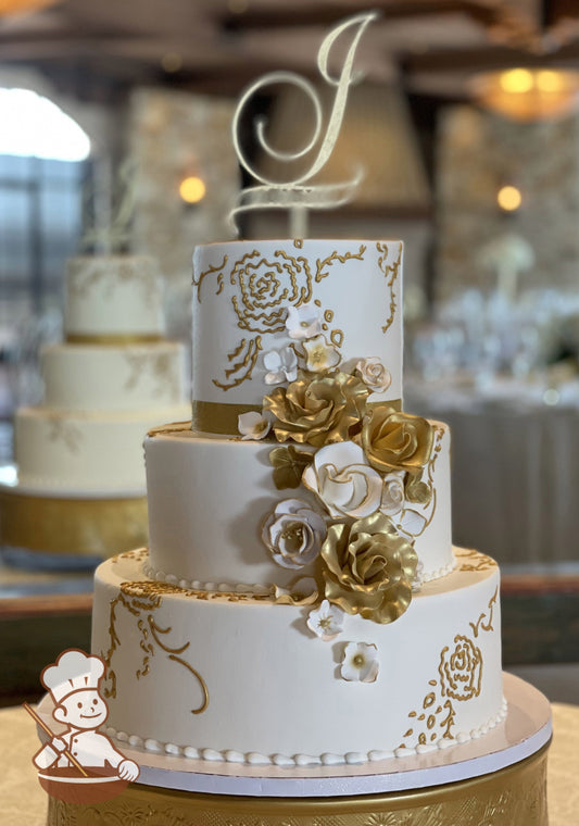 3-tier cake with smooth white icing and decorated with metallic gold pipings and sugar flowers in white and gold colors.
