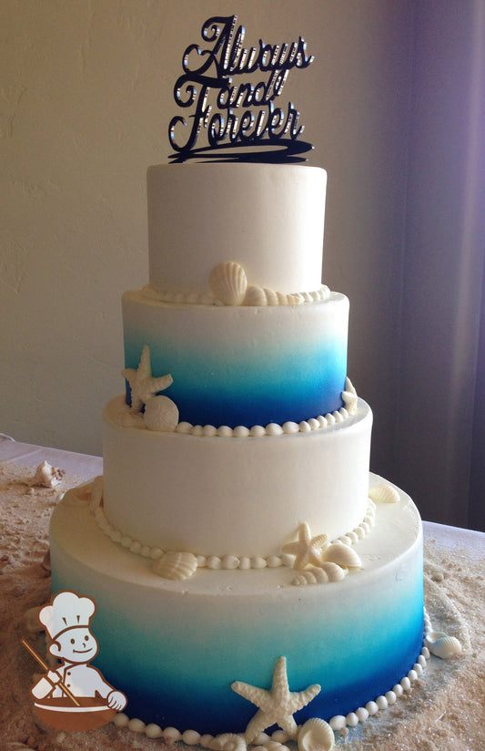 4-tier cake with smooth white icing and decorated with an airbrushed ombre blue coloring on the bottom and third tier and white chocolate shells.