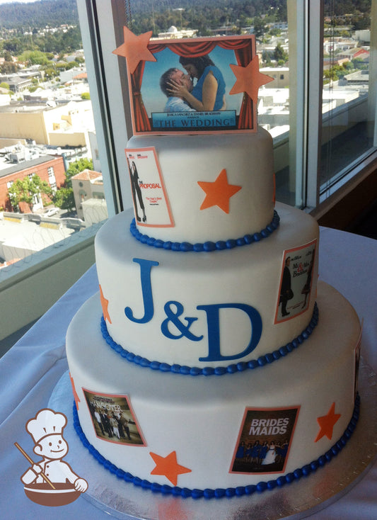 3-tier cake with gold stars and different popular movie posters printed on fondant. Initials J&D on cake wall of middle tier.
