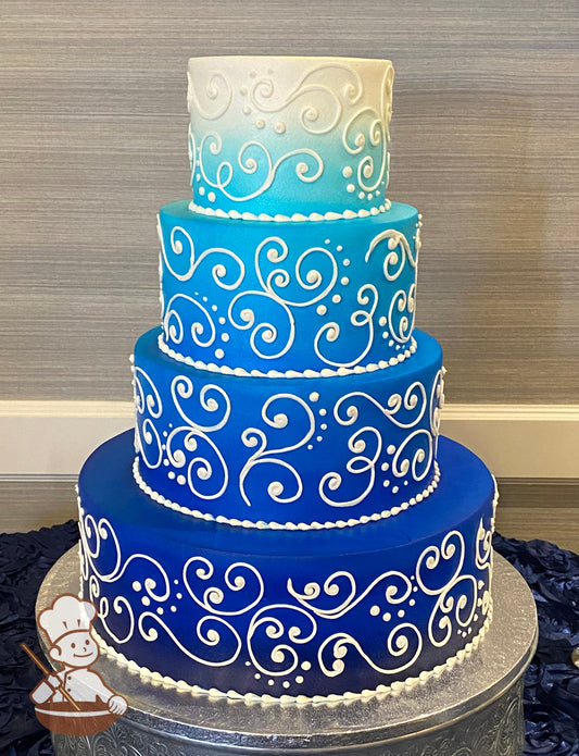 4-tier cake with blue ombre spray and decorated with scroll piping.