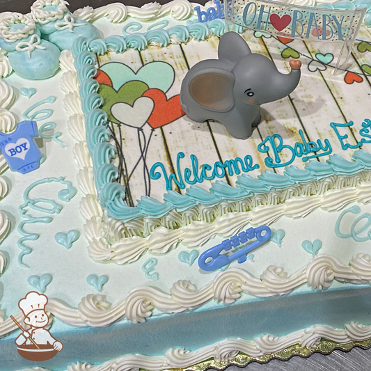 Baby shower sheet cake with toy elephant and Oh Baby banner on photo layer and buttercream baby booties.