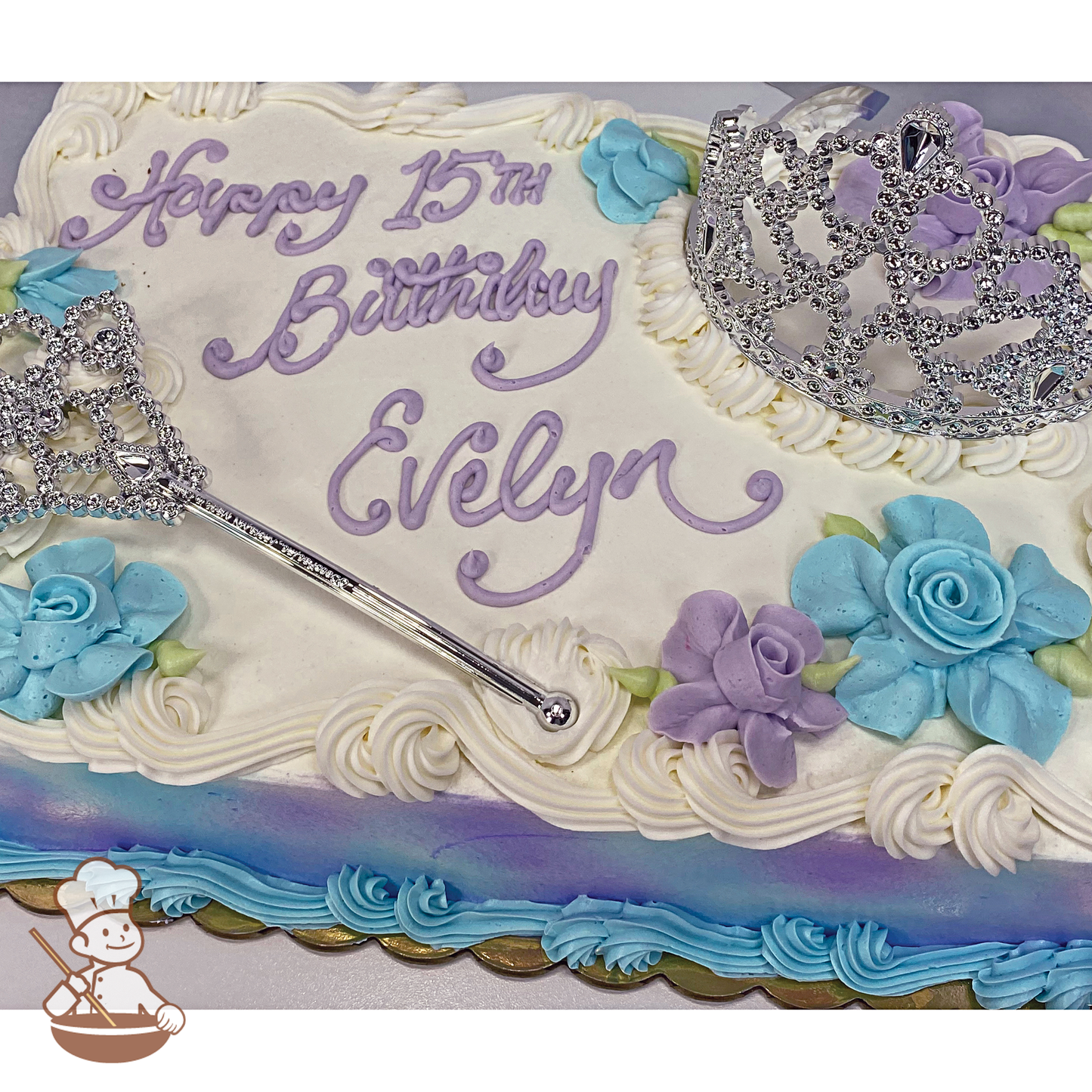 Birthday sheet cake with princess crown, scepter and Hawaiian flowers.