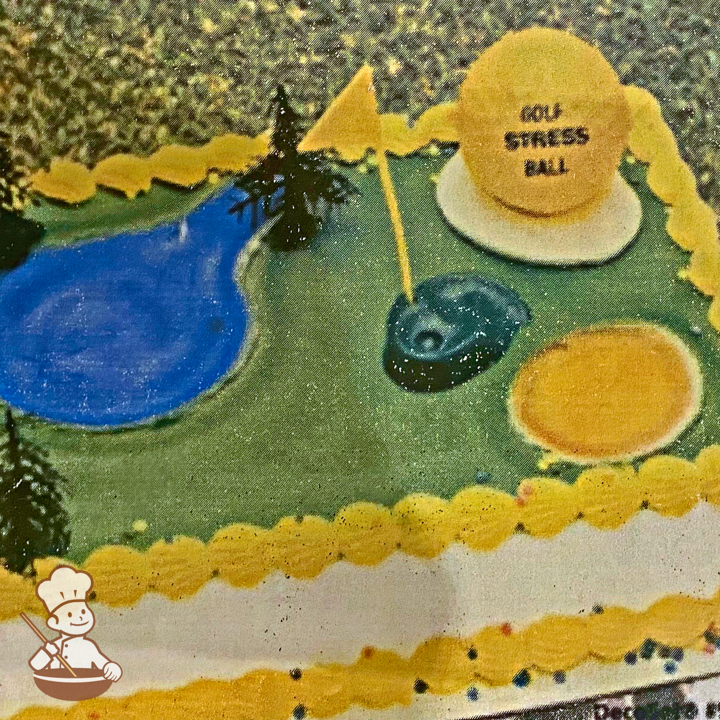 Birthday sheet cake with golf stress ball and course toys.