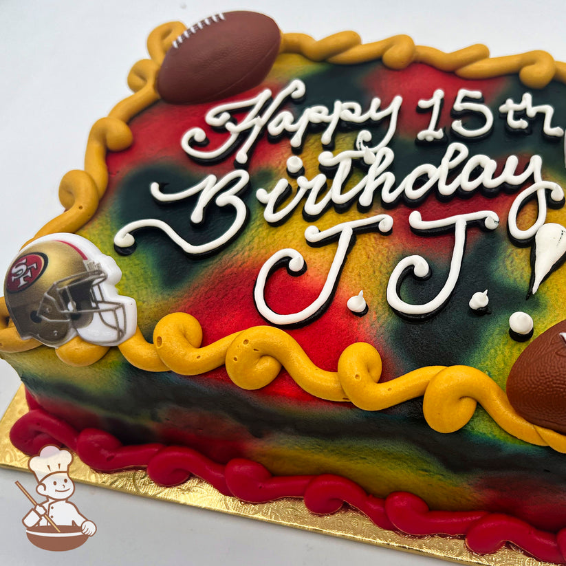 Sheet cake with a camo pattern, featuring a plastic 49ers helmet ring, football ring, and buttercream borders in red and yellow.