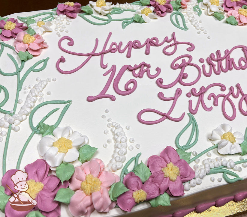 Sheet cake with buttercream flowers, including pink and white blossoms, white lupines, and green ferns.