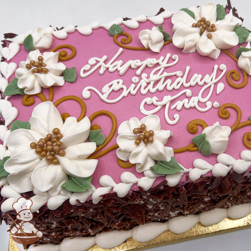 Sheet cake with hot pink frosting, decorated with white buttercream flowers, green leaves, gold scrolls, and heart-shaped lace trim.