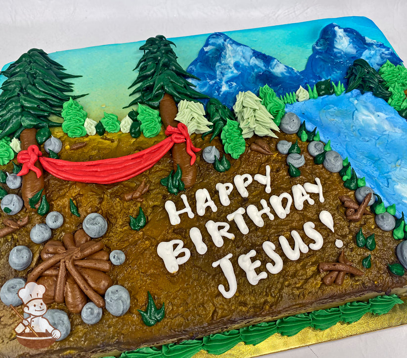 Sheet cake decorated with buttercream mountains, trees, waterfall, campfire, and a red hammock between two trees. Rocks and greenery accent the design.