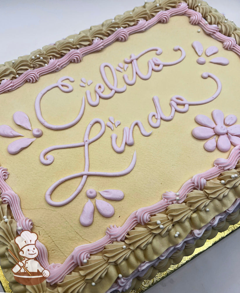Sheet cake with beige frosting, pink piped floral designs, and a decorative border of beige and pink swirls accented with white pearls.