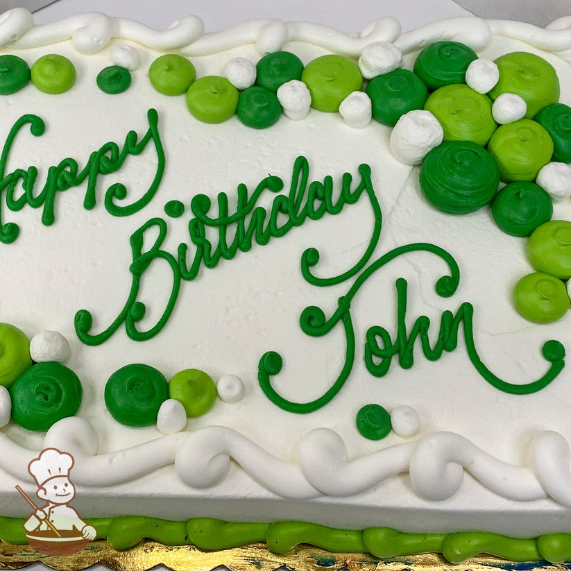 White sheet cake with green and white buttercream dollop clusters. Swirled border and green piping accents.