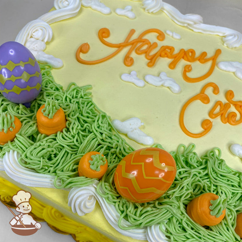 Sheet cake with yellow icing, white clouds, green piped grass, orange buttercream carrots, and plastic Easter egg toppers in orange and purple.