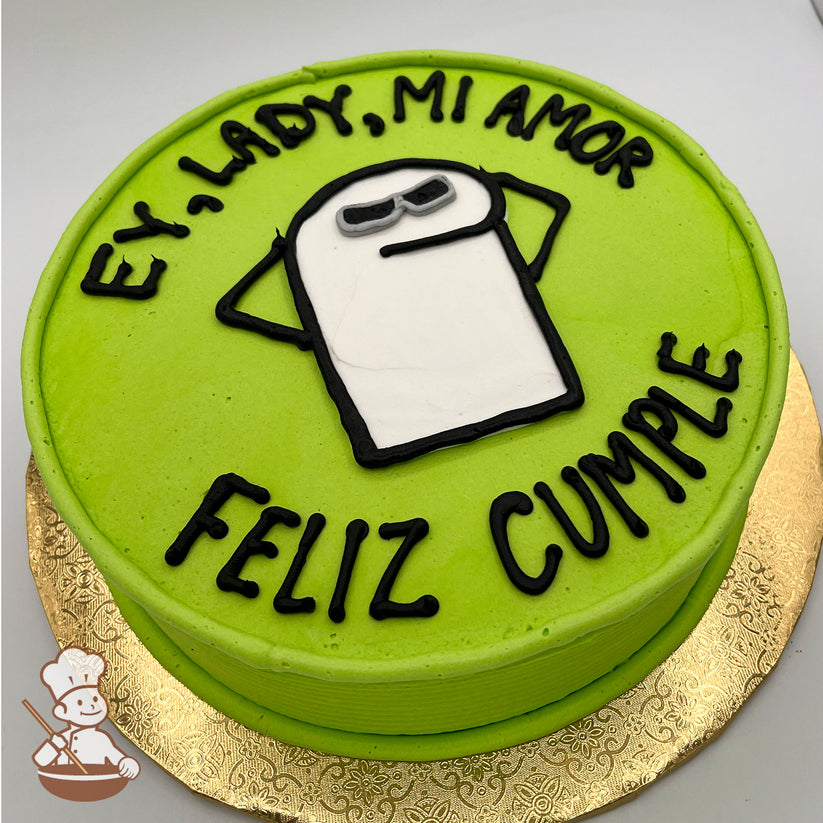 Round cake with green icing, featuring a hand-piped Flork meme character in white and black icing.