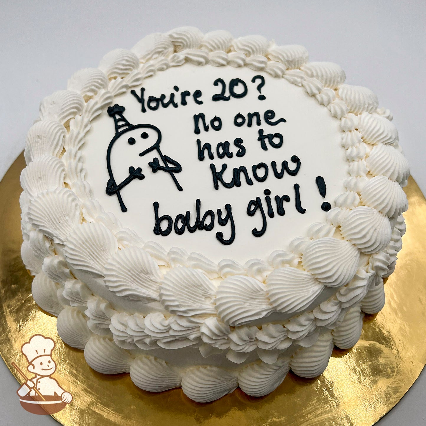 Round cake with white frosting, piped shell borders, and a hand-piped Flork meme character wearing a party hat.
