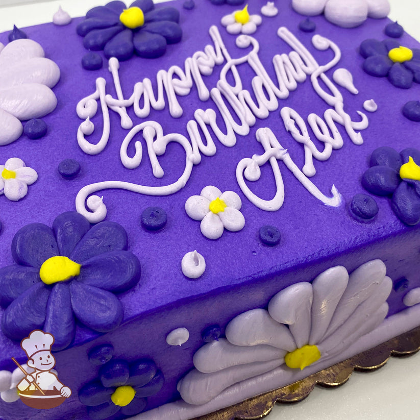 Purple sheet cake with buttercream decorations, featuring purple and lavender Gerbera daisies, small daisy flowers, and yellow centers, accented with dots.