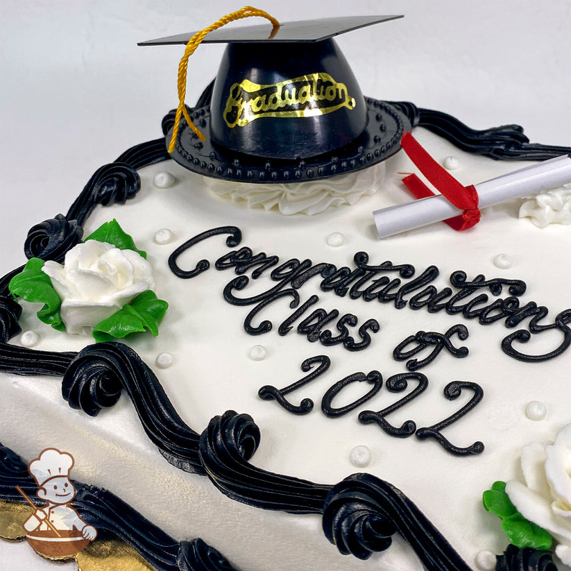 Sheet cake with white frosting, black piped borders, white buttercream roses with green leaves, plastic graduation cap toy, and paper diploma.