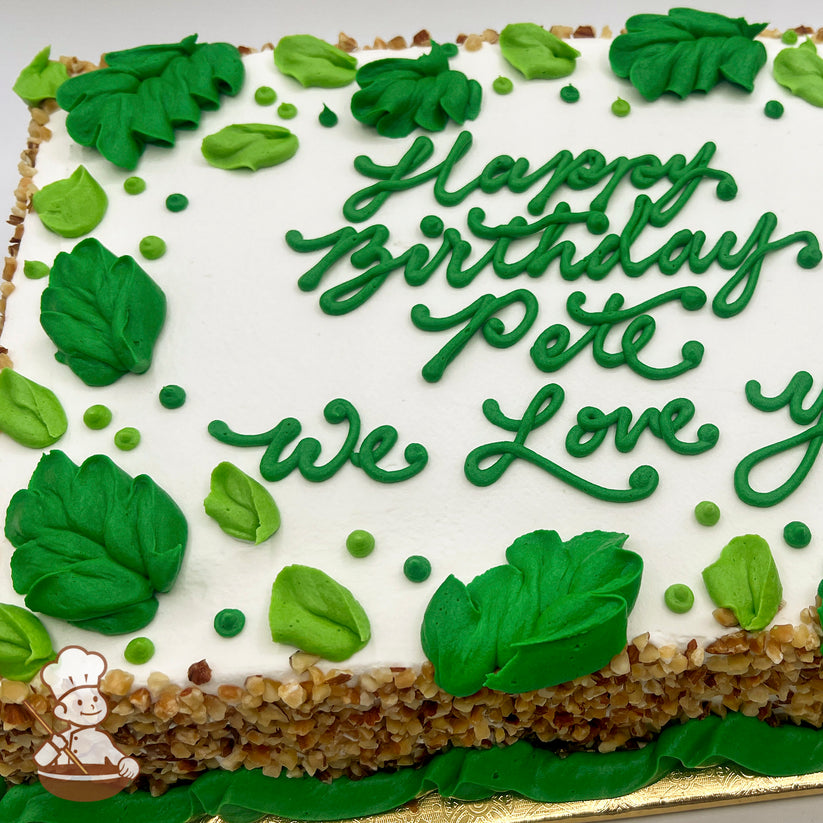 Sheet cake with white frosting, decorated with green buttercream leaves and small green dots.