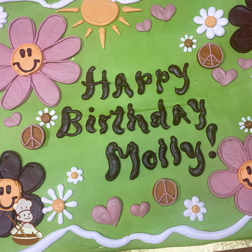 Green sheet cake with buttercream sun, hearts, daisies with happy faces, and peace signs. Pink and brown flowers add a groovy touch.