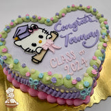 Heart-shaped cake with a pastel purple base, featuring a buttercream Hello Kitty face wearing a graduation cap and holding a diploma with a pink bow. Decorated with vintage-style pastel piping, small buttercream flowers, and buttercream bows along the edges.